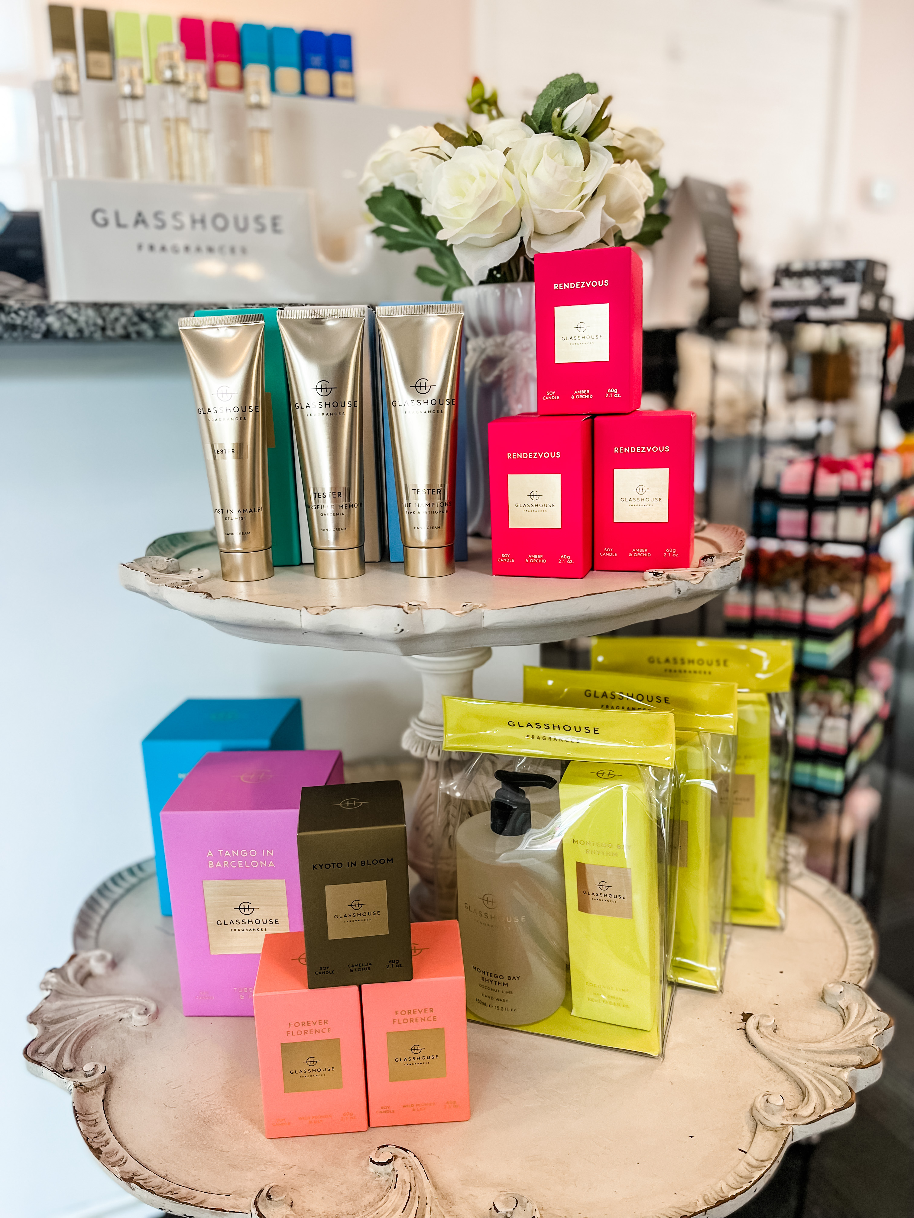 hand lotions and small candles in bright colored packages